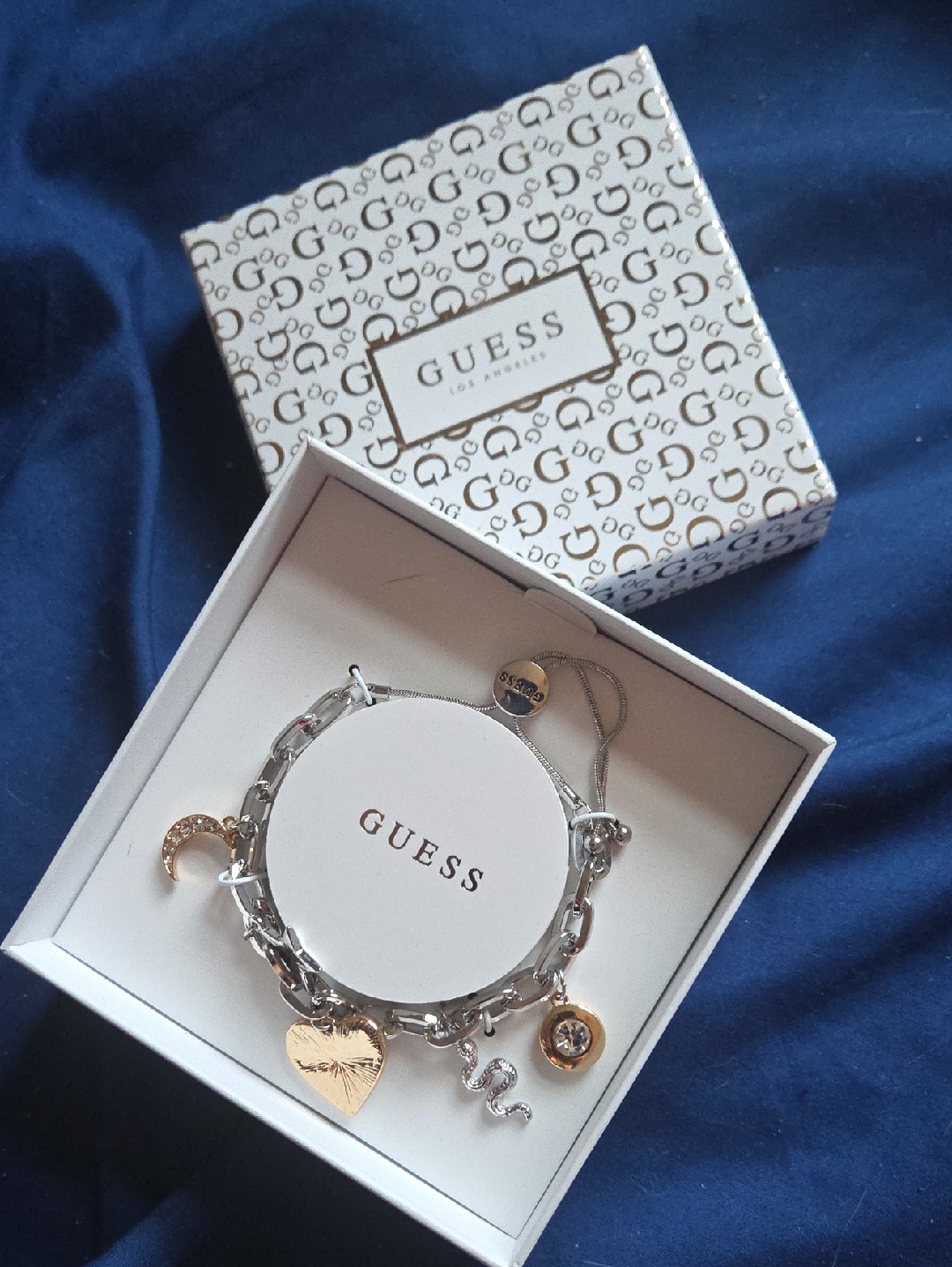 Guess Two-Tone Charm Bracelet With Gold Heart And Silver Snake Charms 35$